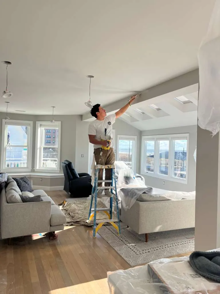 Garden State Contractors interior painting in progress inside a bright coastal living room