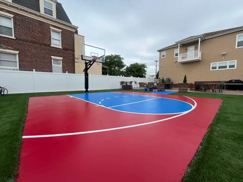 After backyard sport court repaint with red and blue game surface